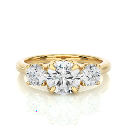 Gold ring with three diamonds on a white background
